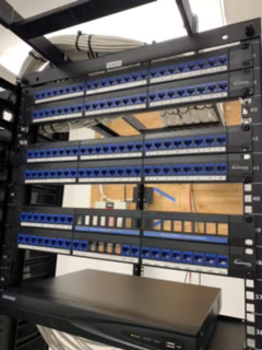 Clean MDF network room with labeled patch panels and cable management
