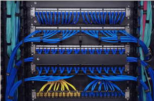 Office ceiling with bundled blue Cat6 cabling on J-hooks